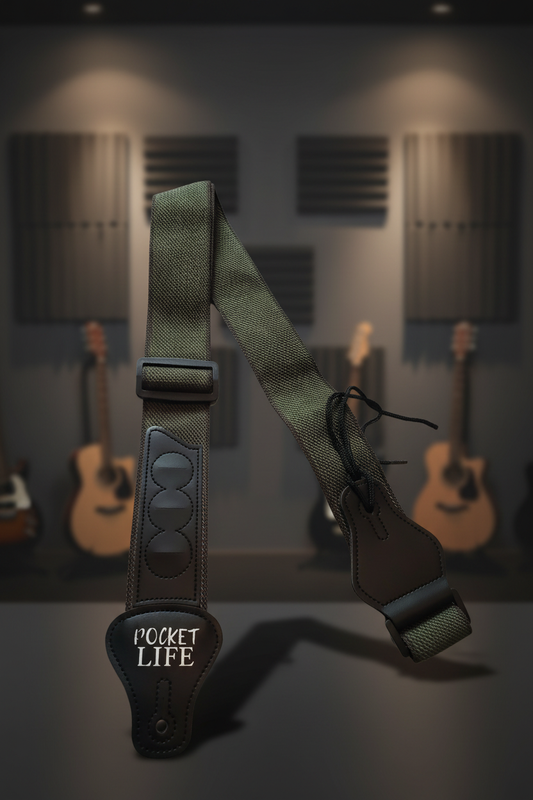 Green and black Pocket Life guitar strap with professional studio background